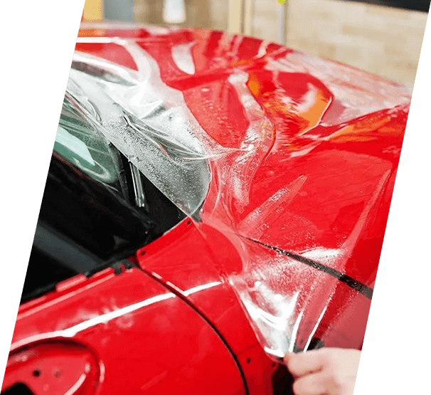 Worker installing 3M Paint Protection Film