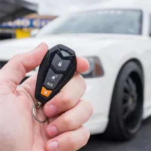 Person grabbing keys with white van in the back